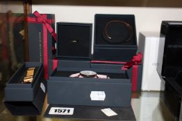 A women's as new Daniel Wellington watch, two additional straps, a ring and a bangle.