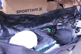 Pre-owned snowboarding equipment to include two boards, two helmets, boots and gloves in a soft