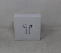 Fifty one pairs of unbranded wireless headphones in charging cases.