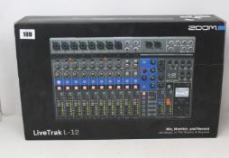 A Zoom LiveTrak L-12 Digital Mixing Console.