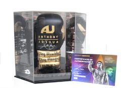 A signed Anthony Joshua boxing glove, display case and certificate of authenticity.