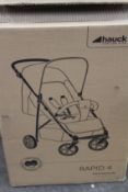 A Hauck Rapid 4 stroller.