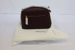 An as new Smaak Amsterdam Blake bag in burgundy.