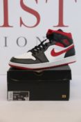 A pair of as New Nike Air Jordan 1 Mid (UK 12).