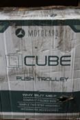 A Motocaddy Cube push golf trolley.