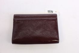 An as new Jimmy Choo Varenne clutch in merlot (No tags but item is as new - RRP £695).