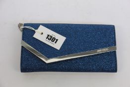 An as new Jimmy Choo Emmie glitter clutch (No tags but item is as new - RRP £520).