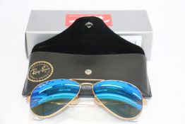 A pair of as new Ray Ban Aviator sunglasses.