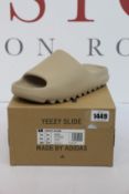 A pair of as new Adidas Yeezy Slide (UK 10).