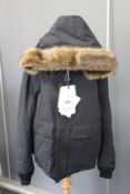 An as new Moncler Cavell Giubotto coat (TG 5 - RRP £1,500).