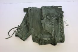 An as new Ulla Johnson jumpsuit in army green (US size 6).