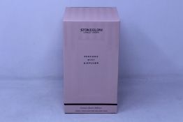 Four boxed as new Stoneglow London perfume mist diffusers.