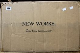 A New Works Kizu large table lamp in White acrylic/marble.