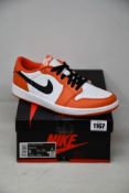 A pair of as new Nike Air Jordan 1 Low (UK 8).