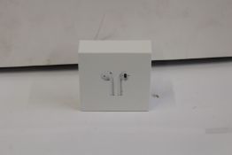 Fifty pairs of unbranded wireless headphones in charging cases.