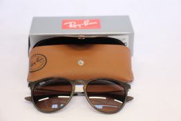 A pair of as new Ray Ban sunglasses.