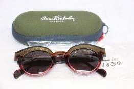A pair of as new Anne & Valentin sunglasses.