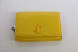 An as new Jimmy Choo Varenne clutch in yellow (No tags but item is as new - RRP £695).