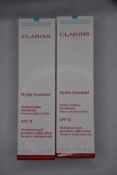 Seven Clarins Hydra-essential SPF 15 moisturises and quenches, milky lotion (6 x 50ml).