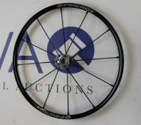 A Spinergy LX.24.12.111 lightweight extreme wheelchair wheel.