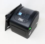 A pre-owned TSC DA200 Desktop Direct Thermal Barcode Printer (Power supply included) (Tested,