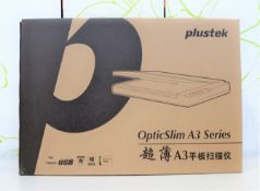 A boxed as new plustek OptiSlim 1180 A3 scanner in grey/silver.