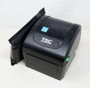 A pre-owned TSC DA200 Desktop Direct Thermal Barcode Printer (Power supply included) (Tested,