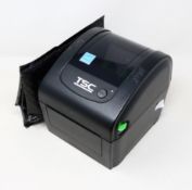 A pre-owned TSC DA200 Desktop Direct Thermal Barcode Printer (Power supply included) (Tested,