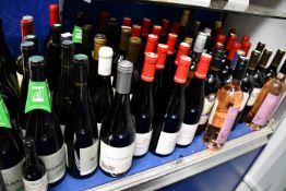 A shelf containing assorted wines to include Bourgueil, Chateau Carignan, Sacramento and