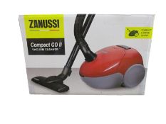A new Zanussi Compact Go ll Red, 750W, 1.5L, 5M automatic cord rewind vacuum cleaner.