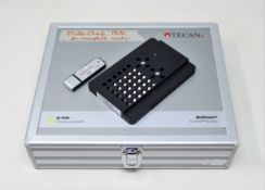A pre-owned Tecan Multicheck Plus II QC Plate for Tecan Infinite Microplate Readers (USB stick