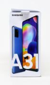 A boxed as new Samsung A31 SM-A315G/DS 128GB in Prism Crush Blue (Box damaged , UK plug included) (