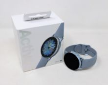 A pre-owned Samsung Galaxy Watch Active2 Aluminium 40mm in Cloud Silver (Boxed. USB charger cable