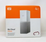 A boxed as new WD My Cloud Home 4TB NAS Drive (Box sealed, some damage to box).