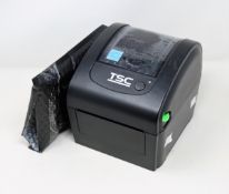 A pre-owned TSC DA200 Desktop Direct Thermal Barcode Printer (Power supply included) (Tested,