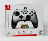 Four boxed as new Nintendo Switch Enhanced Wired Controllers in Mario Silver.