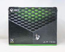 A boxed as new Xbox series X 1TB games console in black (box opened) (box damaged) (2 pin power lead