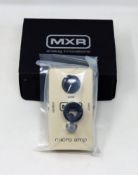 A boxed as new MXR Micro Amp M133 (Some damage to box).