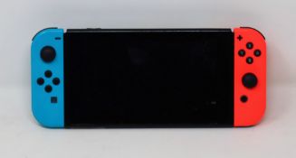 FAULTY - SOLD FOR PARTS - A pre-owned Nintendo Switch games console with Neon Joy-cons (Joy-Con
