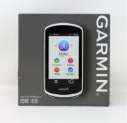 A boxed as new Garmin Edge 1030 GPS Cycling Computer (P/N: 010-01758-10) (Box sealed).