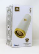 A boxed as new JBL Flip 5 Tomorrowland Edition Portable Bluetooth Speaker.