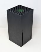 A pre-owned Xbox series X 1TB console in black (unit only) (no cables/controllers).