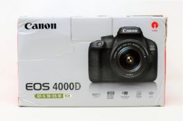 A boxed as new Canon EOS 4000D SLR Digital Camera with EF-S 18-55mm III Lens (Charging dock, UK