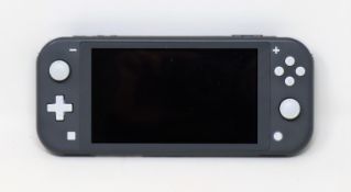 A pre-owned Nintendo Switch Lite handheld games console in grey (charger included).