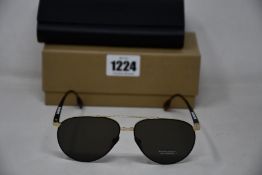 A pair of as new Burberry sunglasses.