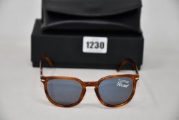 A pair of as new Persol PO3226S sunglasses.