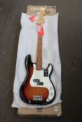 A Fender Player Series Precision Bass in Three Tone Sunburst.