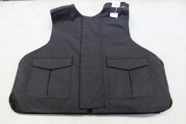 A Safe Guard Armour Patrol 1 tactical armour vest in Black, with a detachable 'Public Safety' Velcro