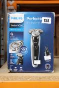 A Philips Series 9000 S9211 wet and dry shaver (Some damage to box).