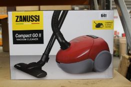 A new Zanussi Compact Go ll Red, 750W, 1.5L, 5M automatic cord rewind vacuum cleaner.